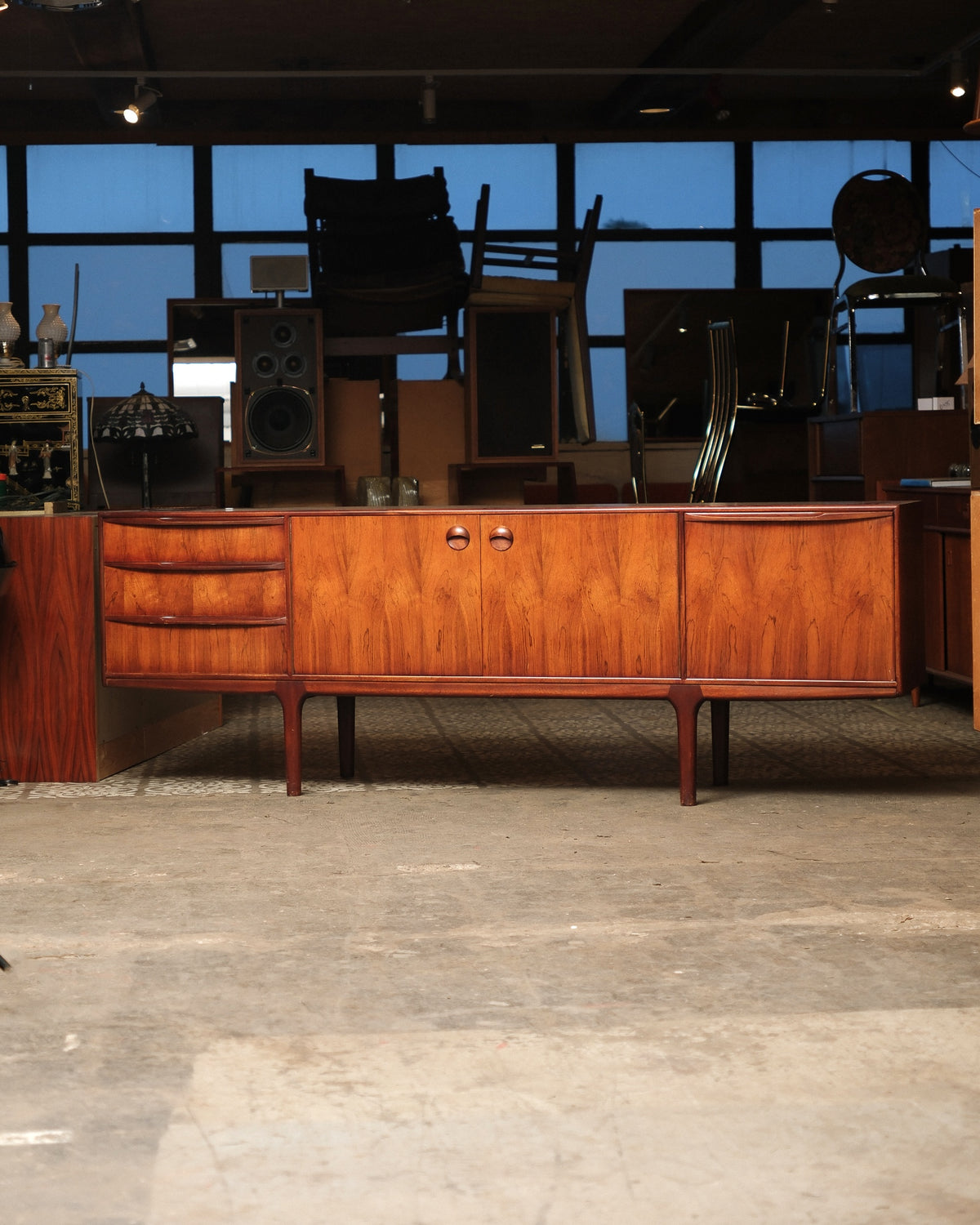 Front view of the rosewood Dunfermline sideboard showing drawers, two-door cabinet, and tapered legs.