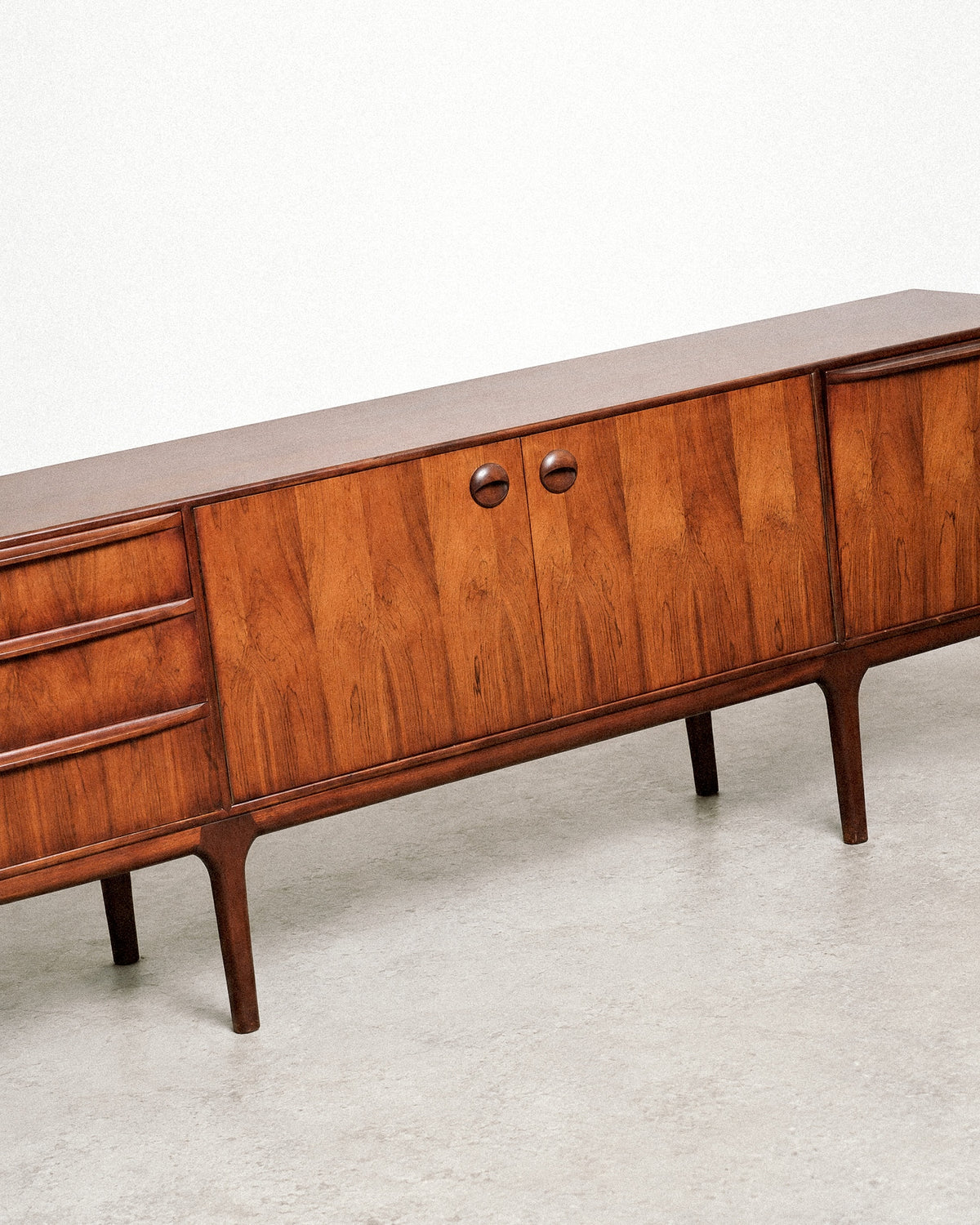 View of the sideboard top showing the rosewood veneer and edge detailing.