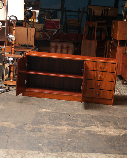 Full view of the sideboard with left cabinet doors open, revealing two adjustable interior shelves.