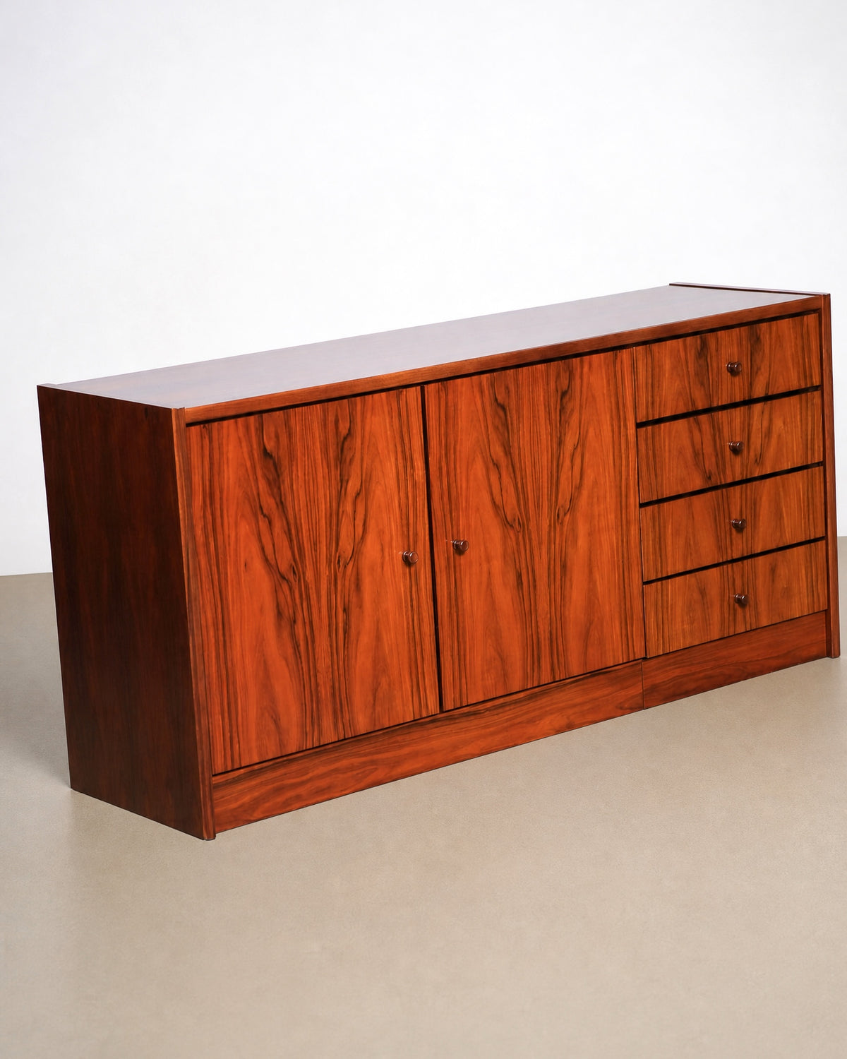 Close view of the drawer fronts and round wood knobs.