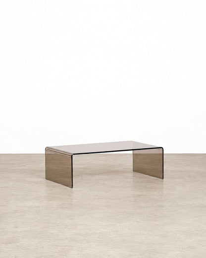 Additional angle of the smoked lucite waterfall coffee table showing its overall form and proportions.