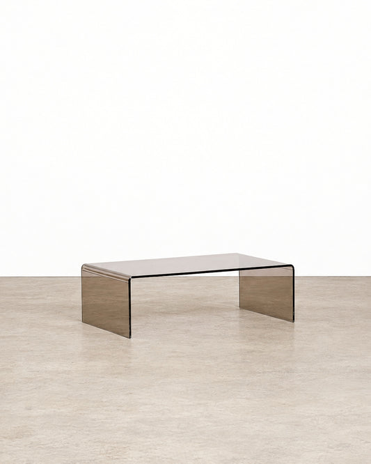 Additional angle of the smoked lucite waterfall coffee table showing its overall form and proportions.