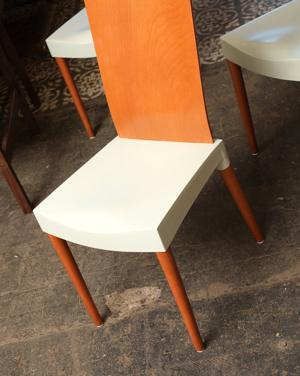Overhead view of a Miss Trip chair seat and back joint, showing the bentwood grain and leg attachment.
