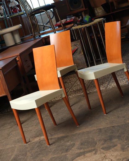 Three Miss Trip chairs arranged together showing the matching bentwood backs and cream seats.