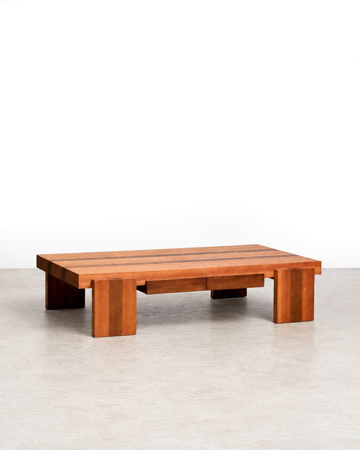 Front view of the coffee table showing its low profile and two built-in drawers.