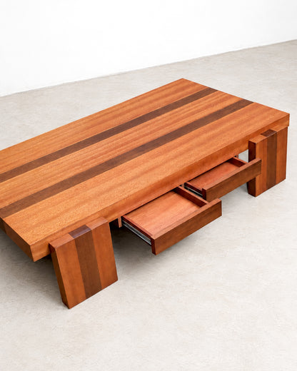 Overhead angled view of the coffee table with both drawers open, showing metal slides.