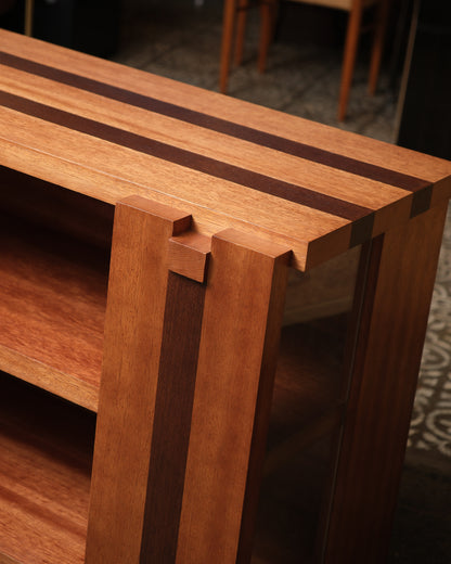 Detail of the finger-joint corner construction and contrasting wood stripe inlay.
