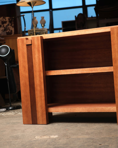 Side view showing the open shelving and striped banding along the cabinet's edge.