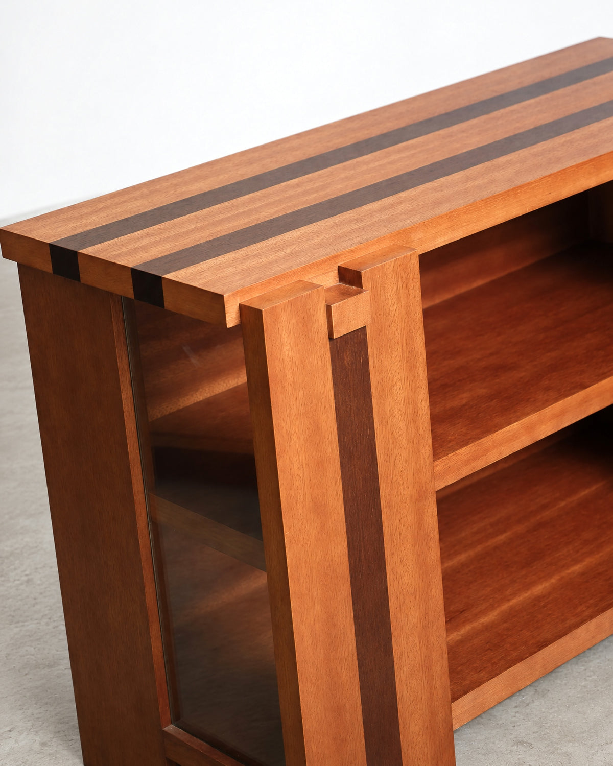 Close-up of the top surface and corner joinery showing the striped wood pattern.