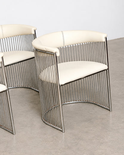 Front view of a single chair showing the barrel shape and leatherette cushion.