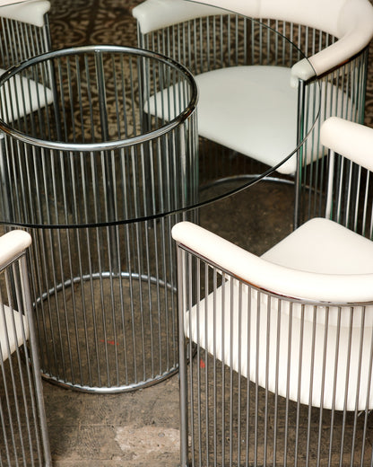 Side view of the chrome rod base table showing its cylindrical form.