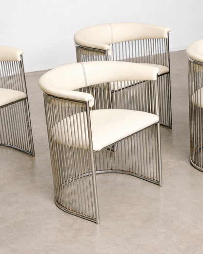 Close-up of the chrome vertical rods forming the chair and table bases.