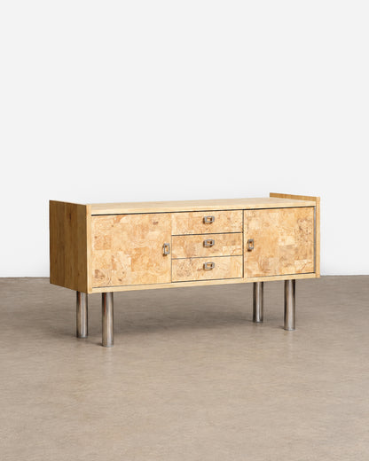 Wide shot of the sideboard in the showroom setting among other vintage furniture.