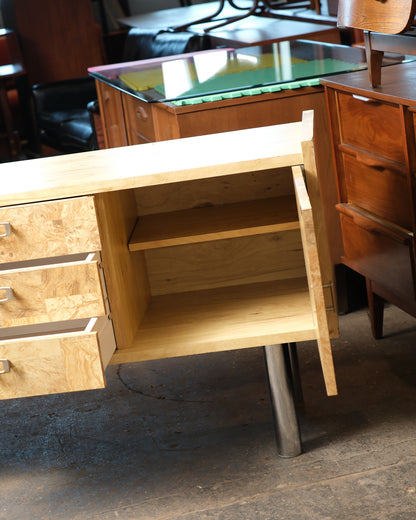 Open cabinet door revealing the adjustable interior shelf.
