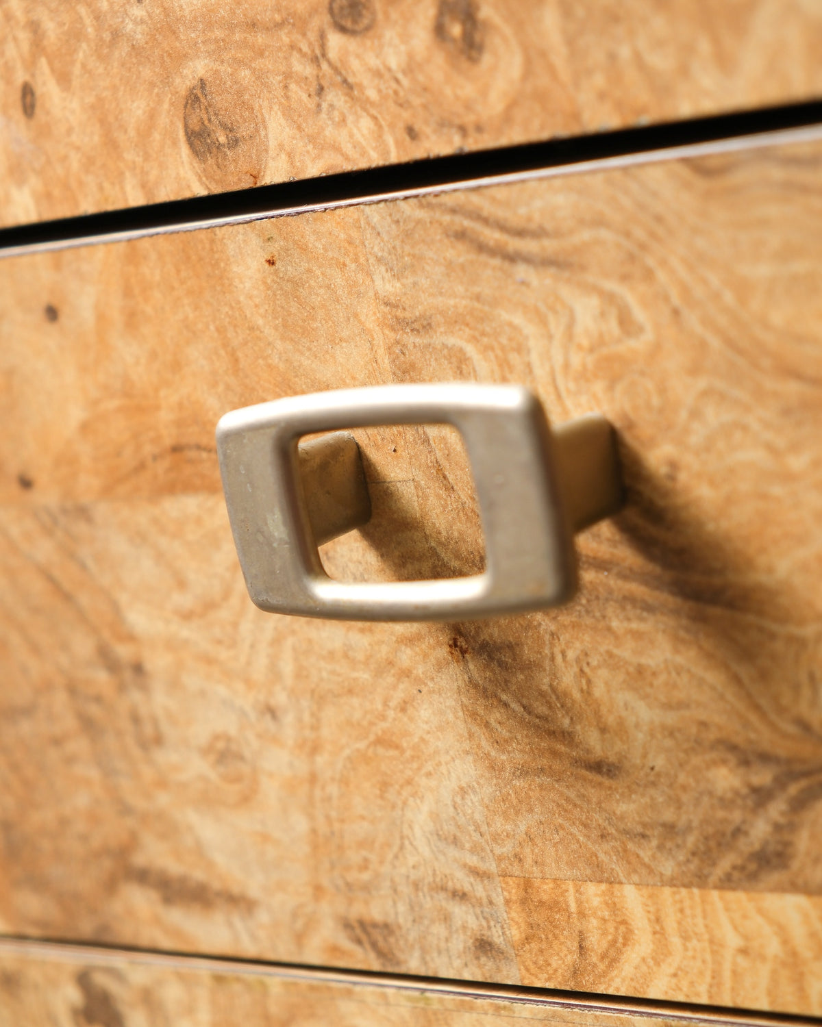 Additional view of the burlwood sideboard highlighting the veneer grain pattern.