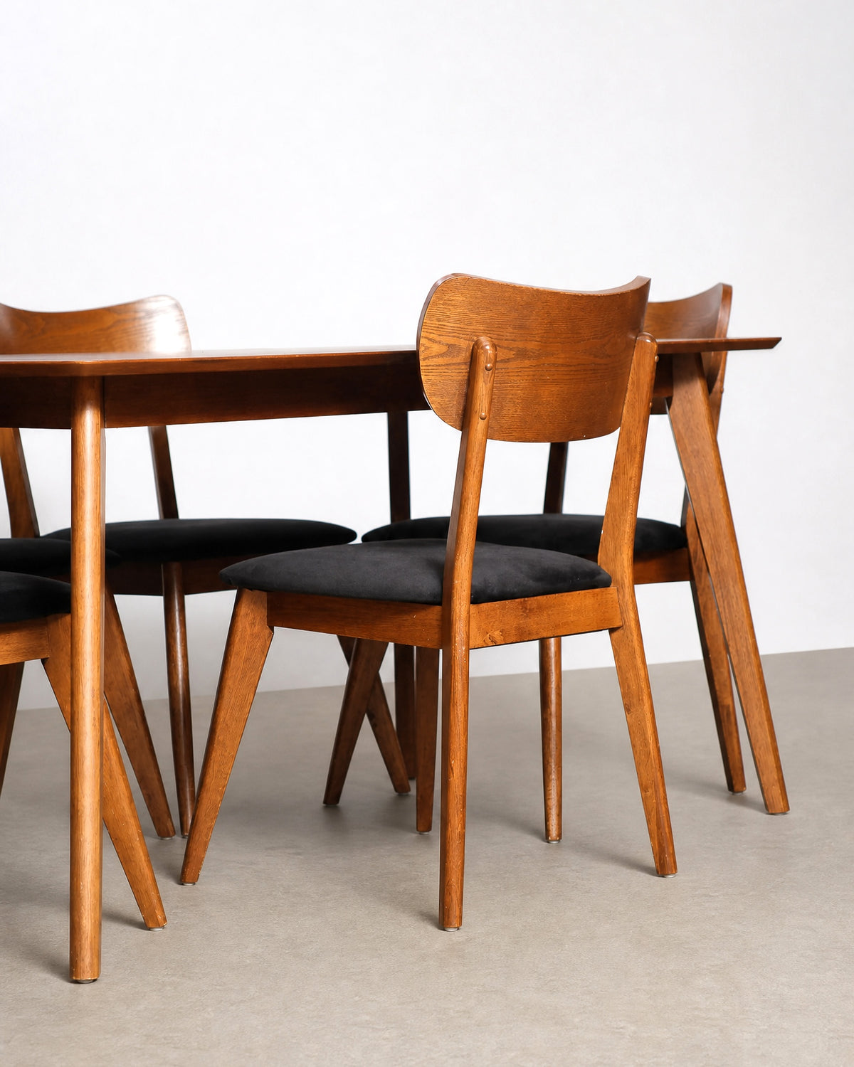 Another angle of the chairs grouped together showing the black velvet seat fabric.