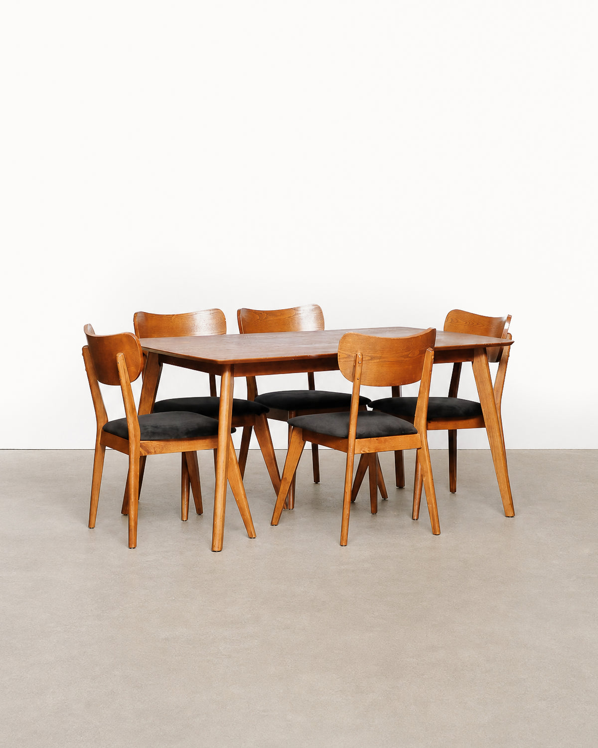 Additional angle of the dining table and chairs showing overall proportions.