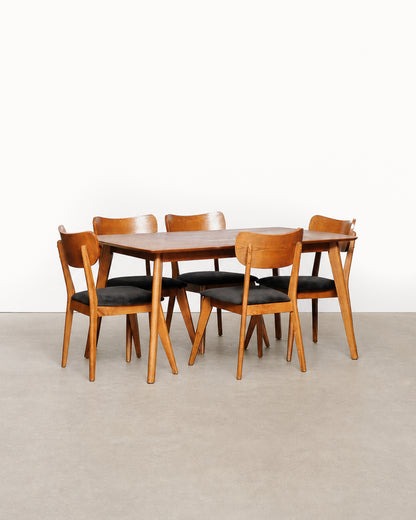 Additional angle of the dining table and chairs showing overall proportions.