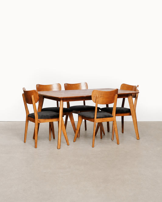 Additional angle of the dining table and chairs showing overall proportions.