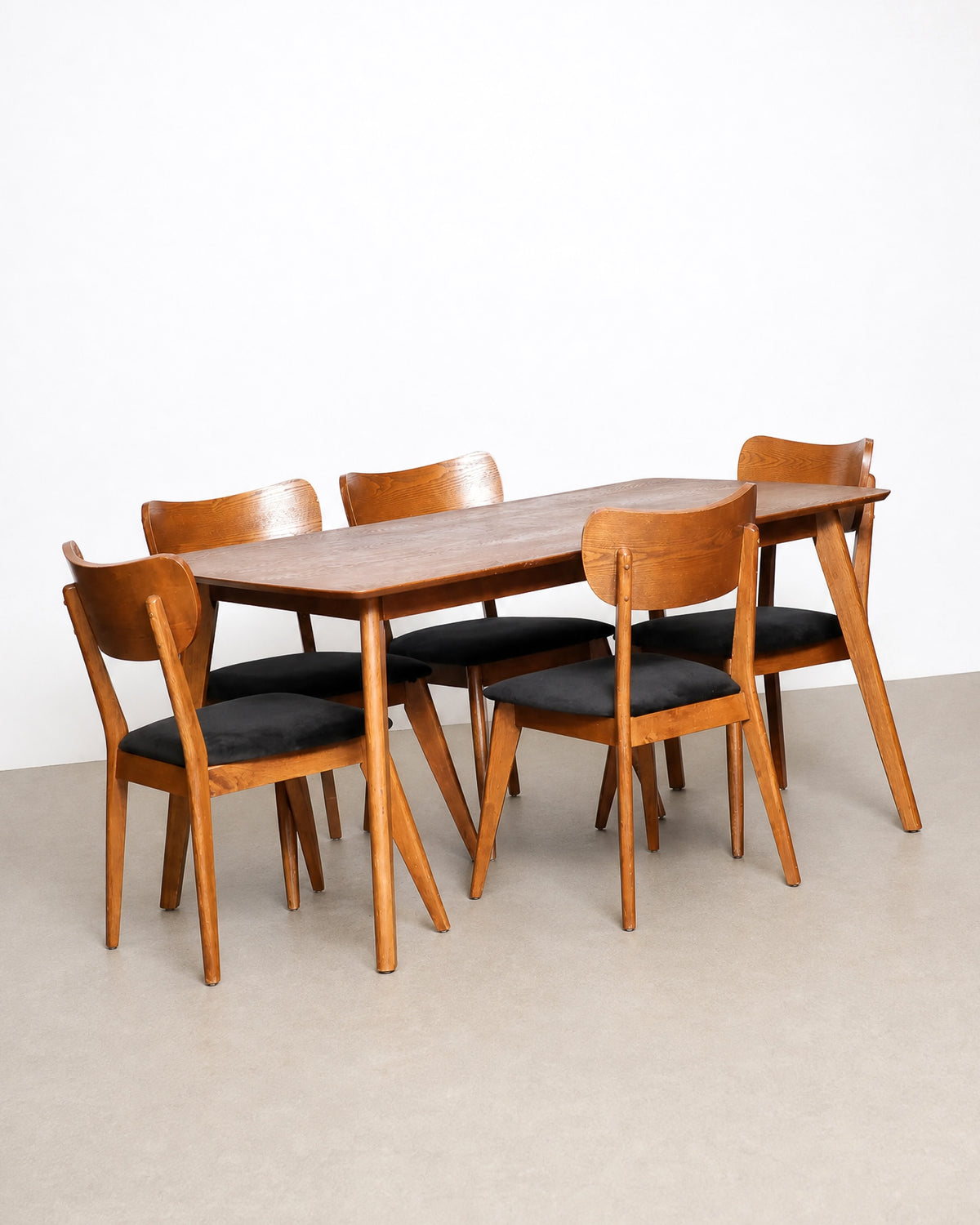 Side view of a single chair highlighting the leg splay and seat shape.
