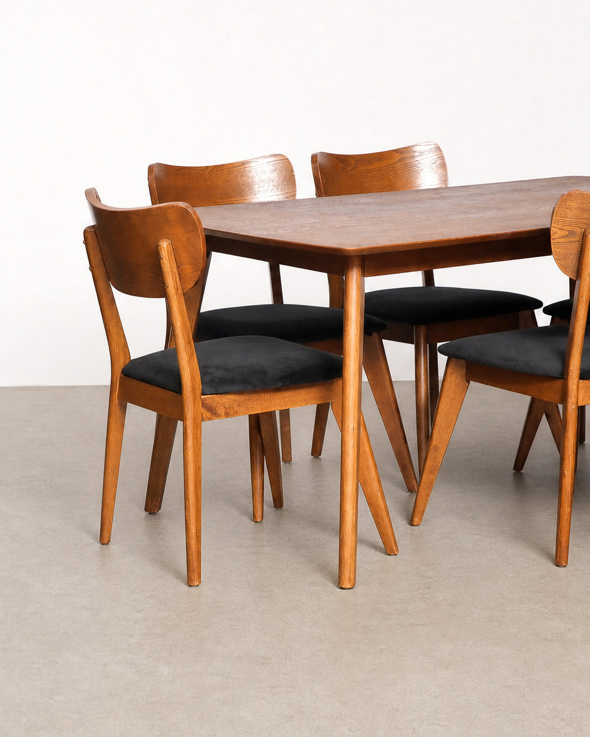 Detail of the chair backrest wood grain and curvature.