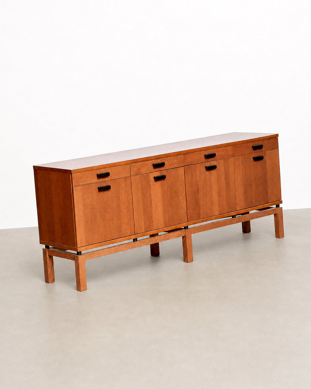View of the sideboard's base and legs showing the stepped platform design.