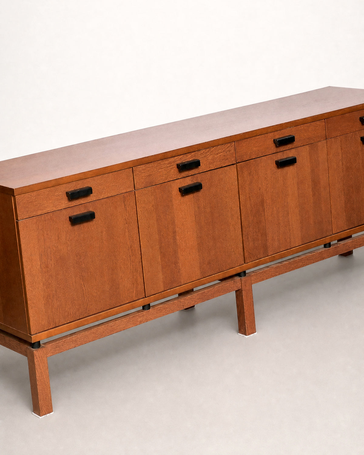 Side view of the oak sideboard highlighting the depth and leg construction.