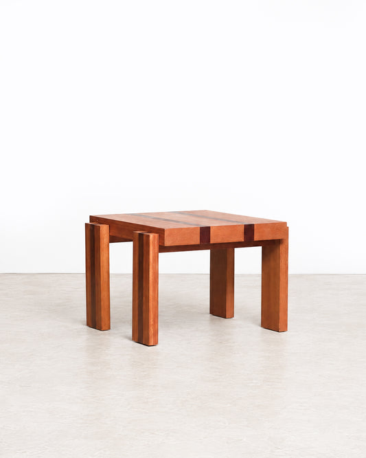 Further studio view of the coffee table highlighting its geometric design and wood tones.