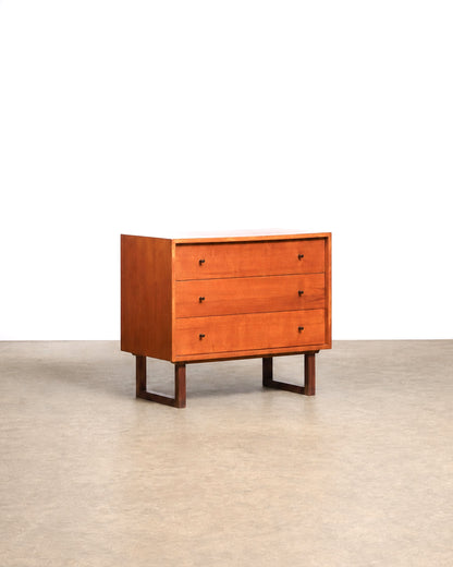 Vintage teak tallboy dresser by RS Associates on a plain white background — warm natural teak grain and understated profile