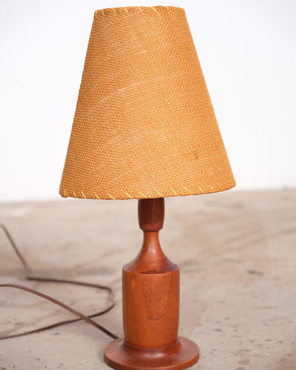 Front view of the walnut lamp showing base and shade proportions.
