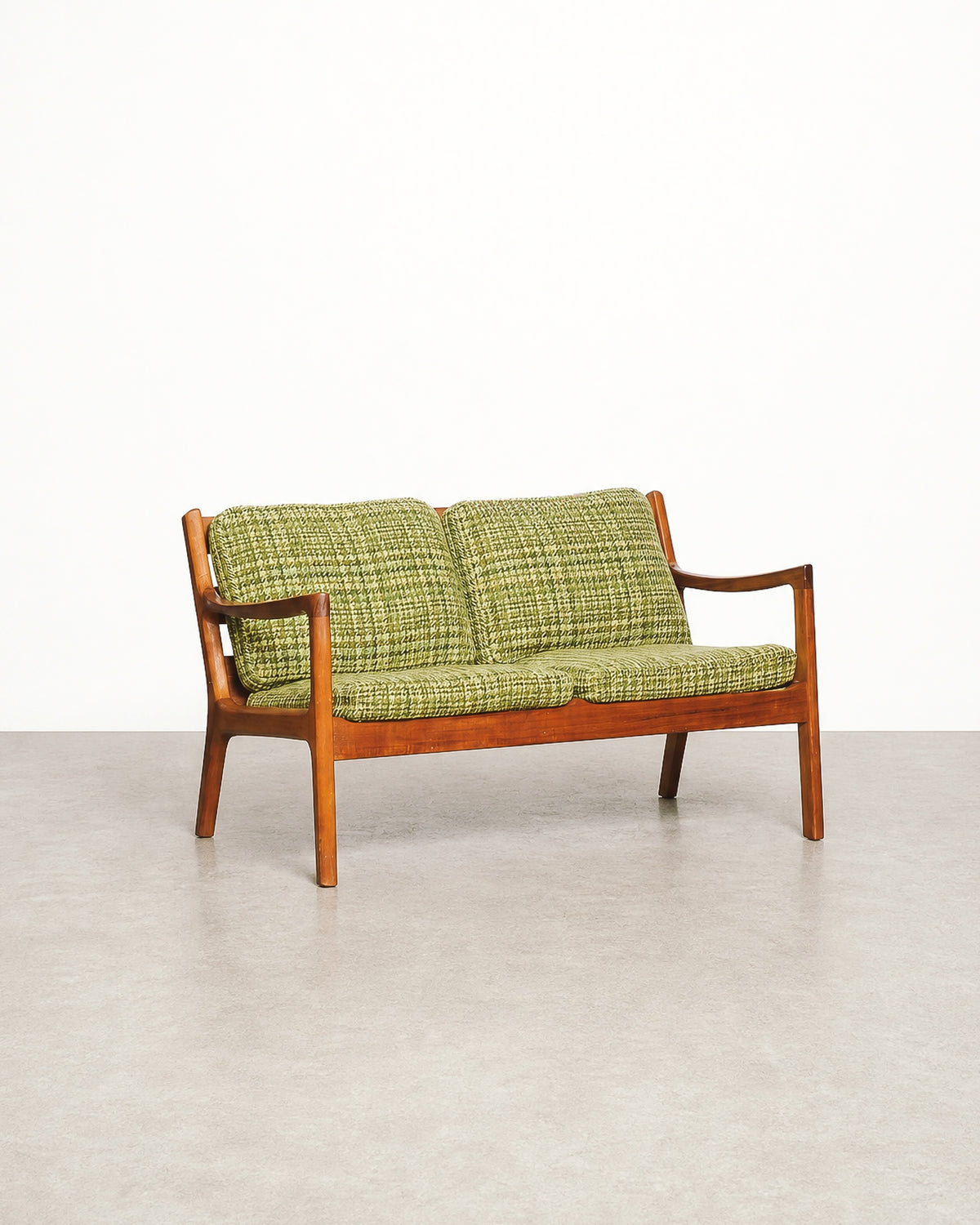 Close-up of the back cushion corner showing upholstery weave and piping.