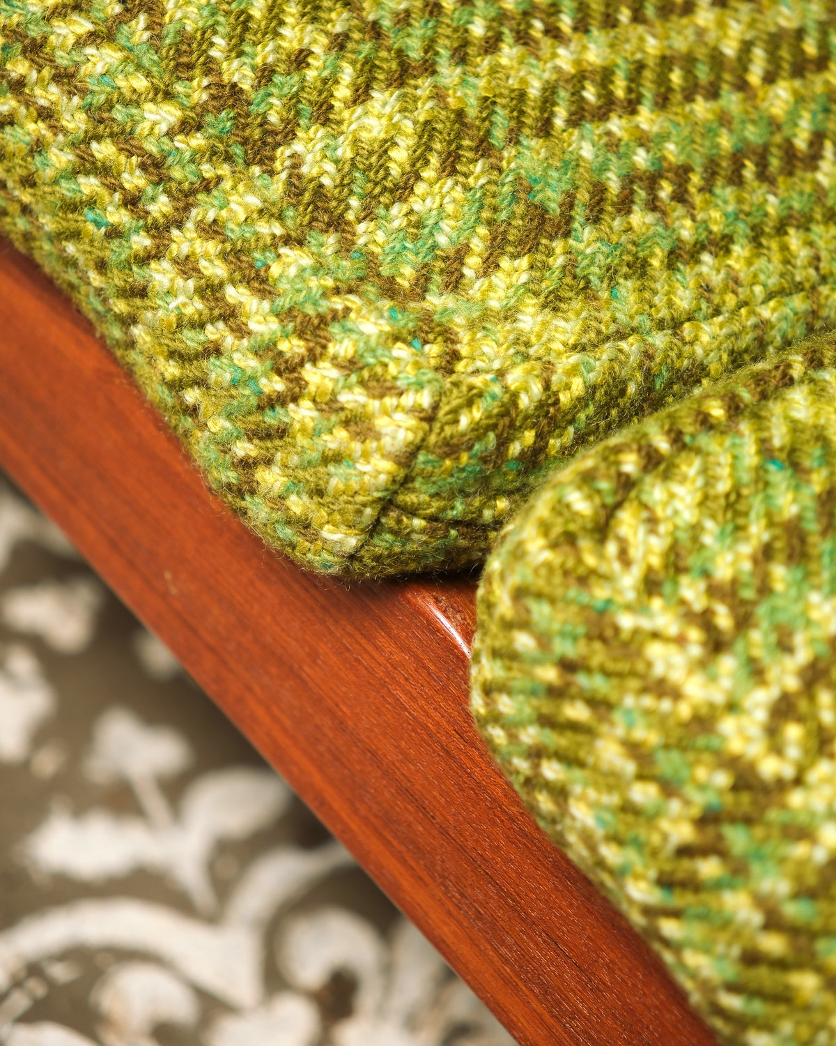 Detail of the teak backrest slats and cushion placement.