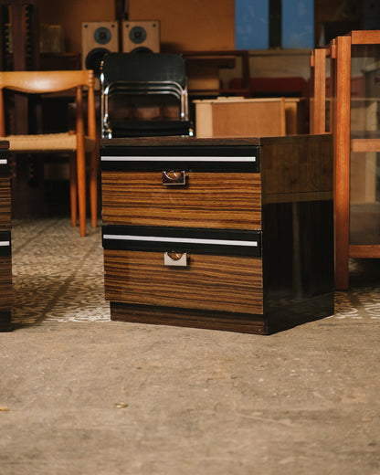 Full view of one nightstand in a showroom setting, showing overall proportions and finish.